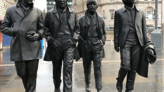 the Beatles bronze statues in walking pose