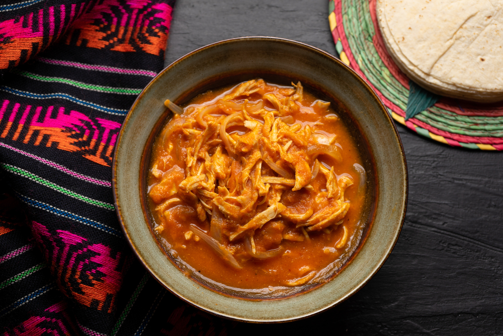 Traditional,Mexican,Chicken,Tinga,With,Chipotle,Sauce,On,Dark,Background